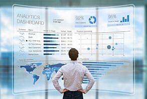 Businessman analyzing business analytics or intelligence dashboard