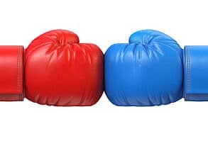 Red and blue boxing glove against each other
